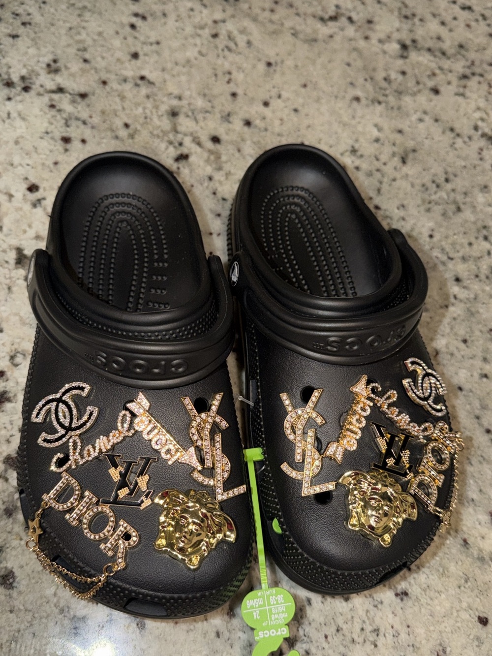 CROCS Black with gold designer inspired charms.